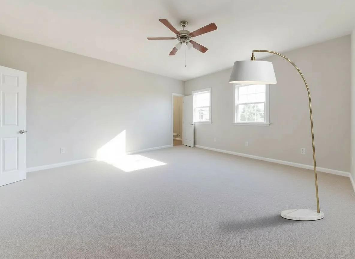 A brass arc floor lamp placed into an empty bedroom: after
